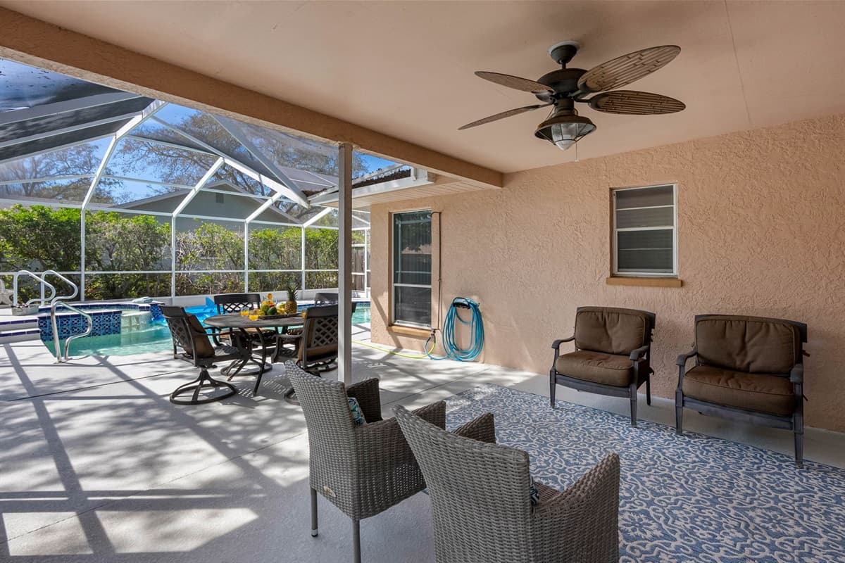 With ceiling fans to keep the air moving and the full enclosure offering shade and protection, the space remains inviting even during the warmer parts of the day.