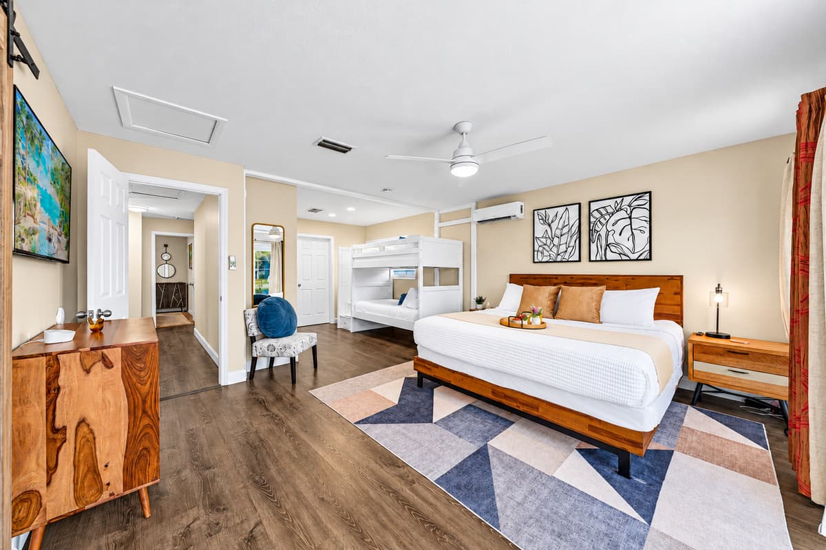 Bright and airy bedroom offering comfortable sleeping arrangements for families and groups.