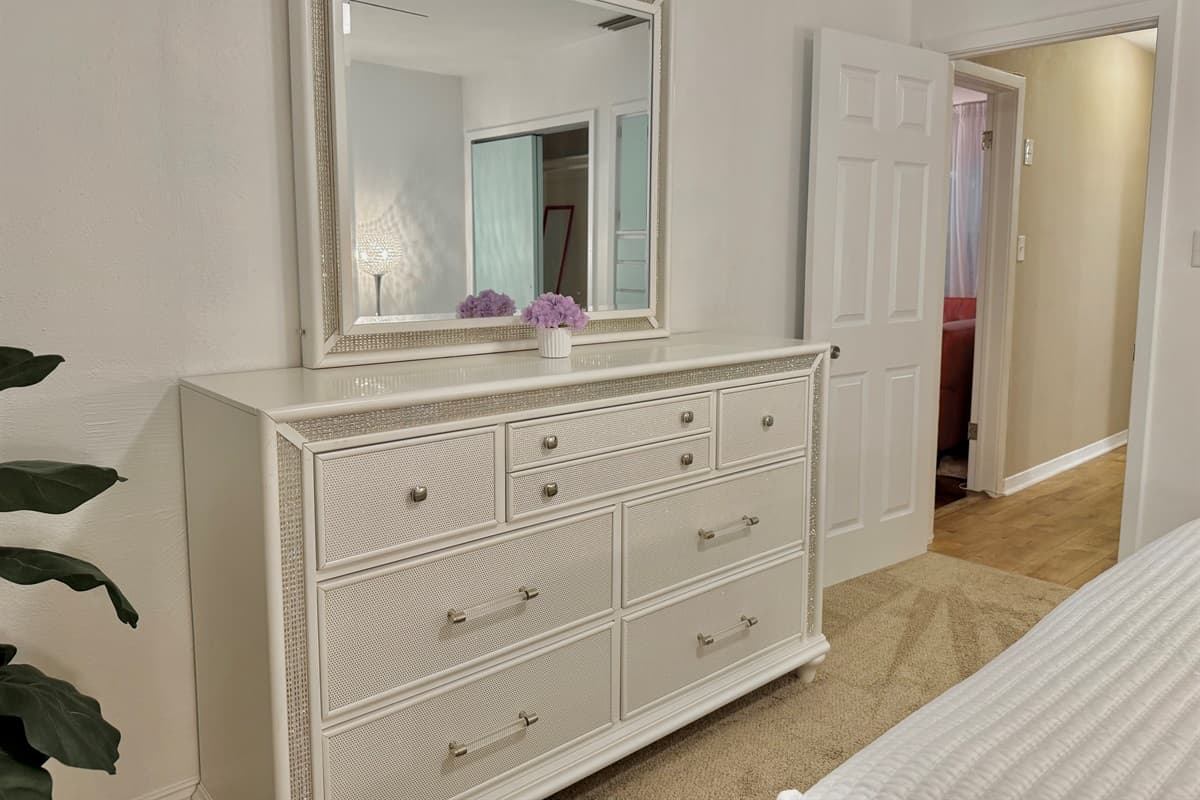 This bedroom offers the perfect balance of chic design and serene comfort—ideal for restful nights after sunny Florida days.
