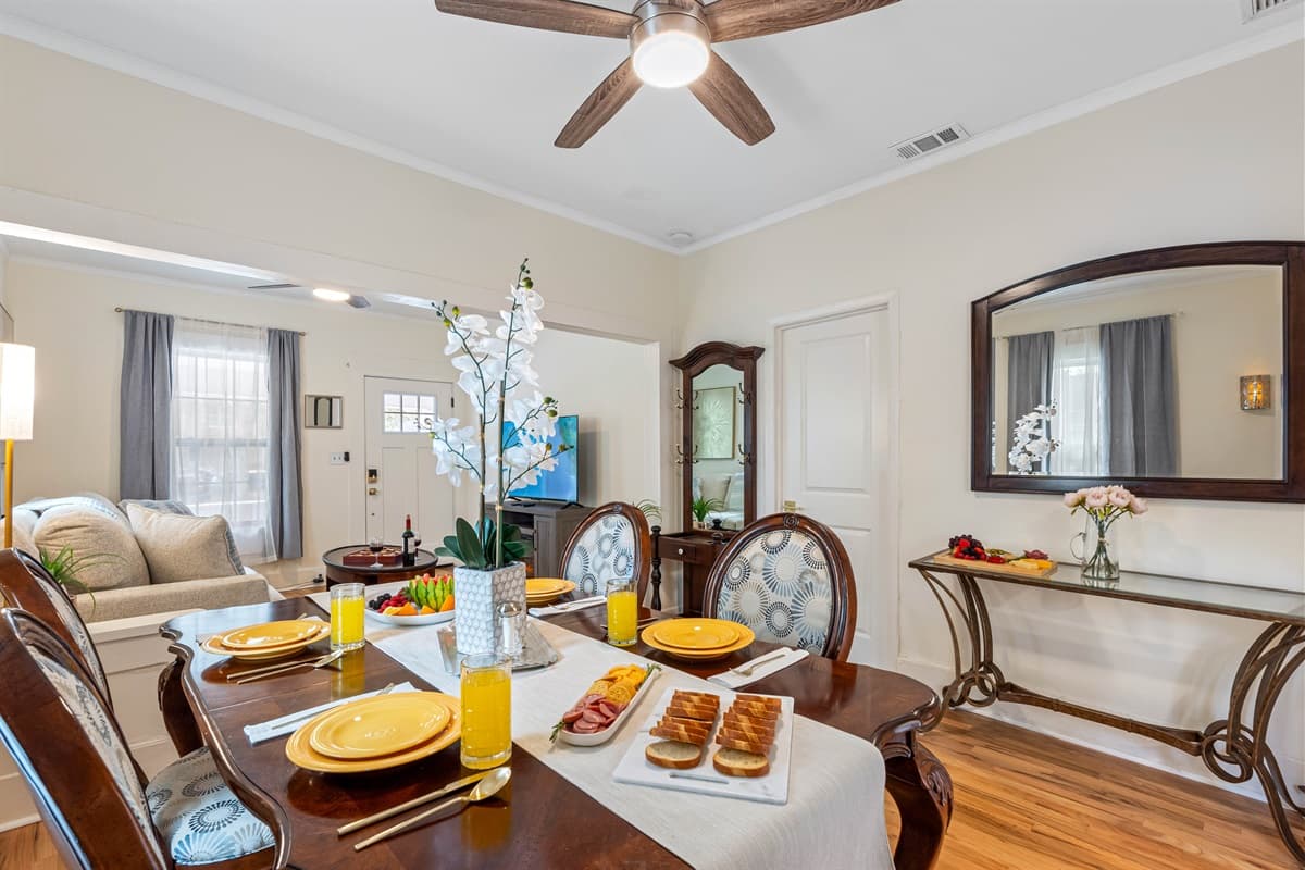 The dining area is conveniently located just a few steps from the kitchen, making it easy to transition from cooking to dining without skipping a beat.