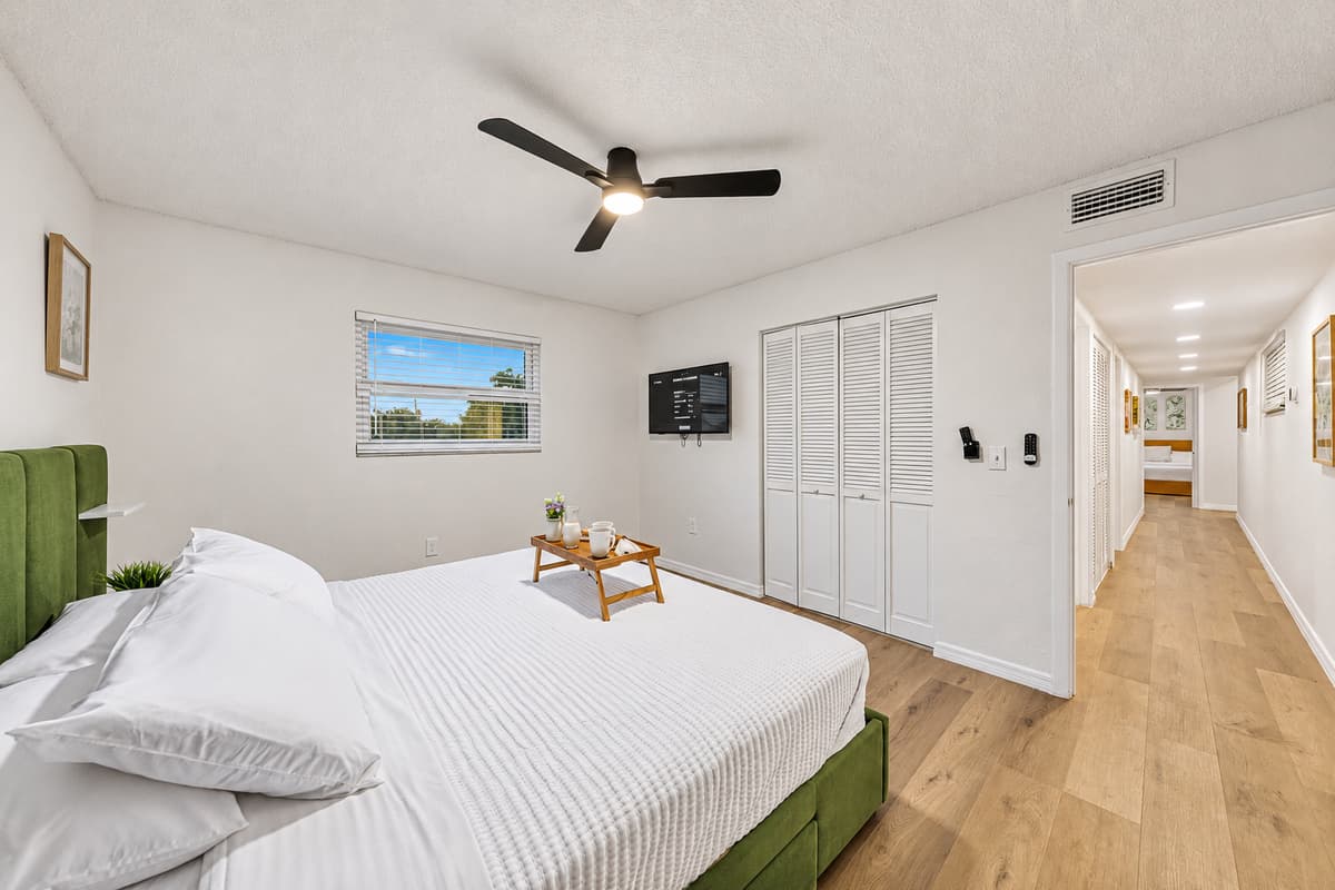 Spacious king bedroom with simple, modern styling and plenty of room to unwind after a long day 