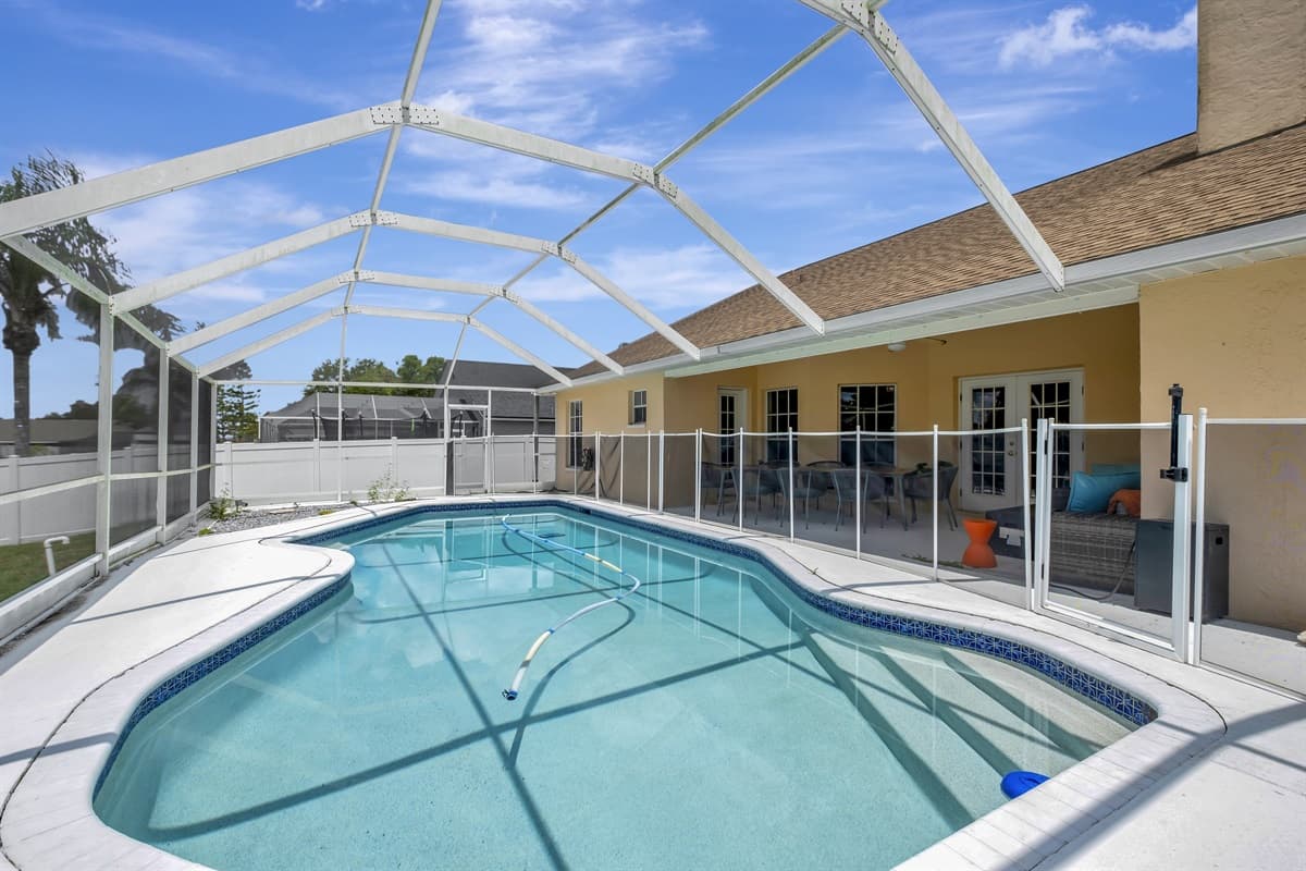 The centerpiece of this outdoor oasis is a sparkling pool, inviting you to take a refreshing dip and escape the heat of the day.