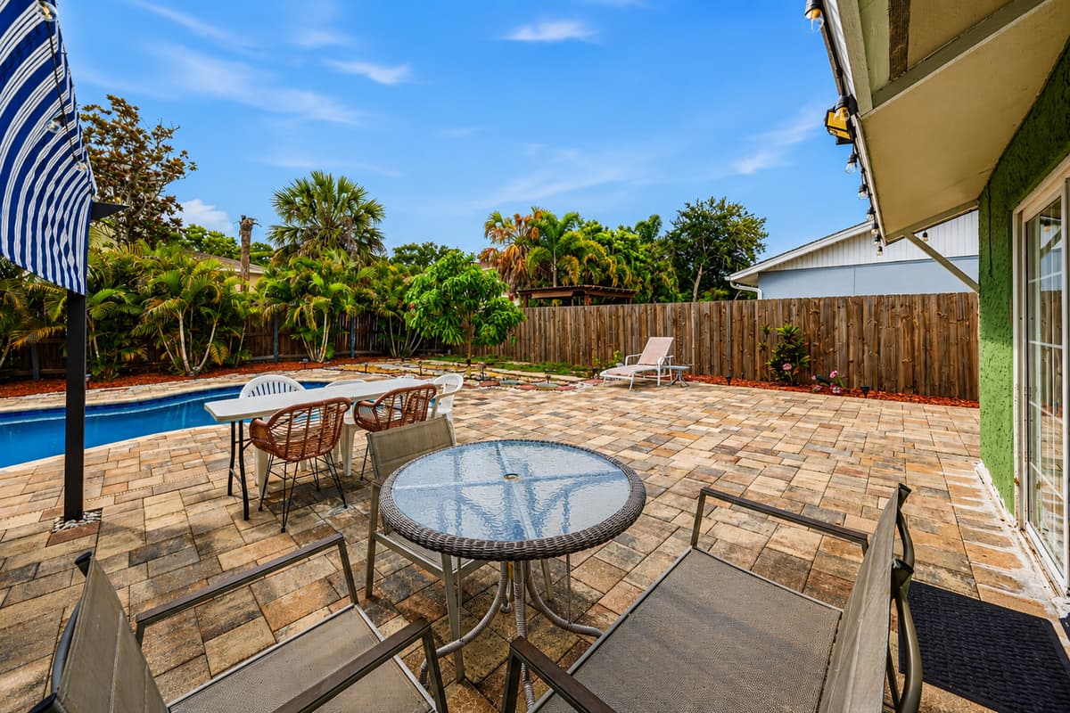 Relax outdoors with shaded seating, outdoor dining, and views of the private pool.