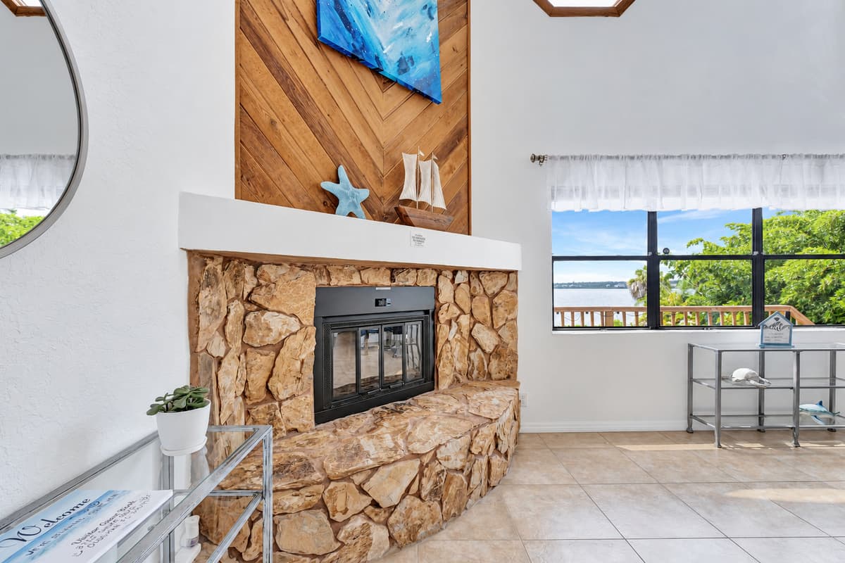 At the heart of this space lies a cozy fireplace, radiating warmth and creating a captivating ambiance that invites you to unwind and linger a while longer.