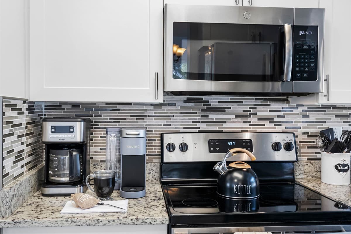 From morning coffee to full dinners, this kitchen has everything you need, including a microwave, toaster, and coffee maker.