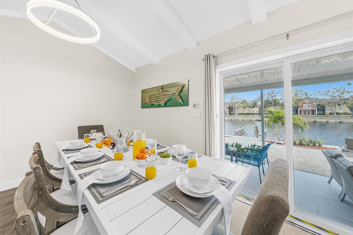 Dine with beautiful waterfront views through large sliding glass doors.