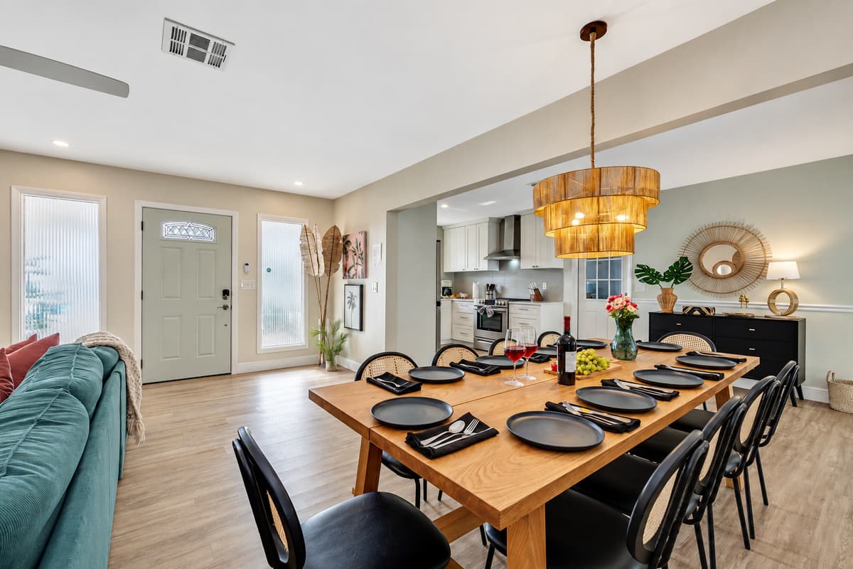 The centerpiece of the dining area, the 10-seater wooden dining table, commands attention with its craftsmanship and beauty.