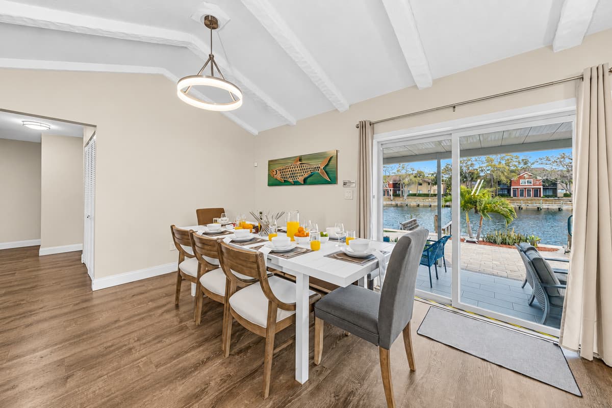 Elegant dining table set for memorable meals overlooking the water.