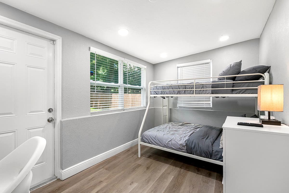 This delightful bedroom features a charming bunk bed, perfect for fun-filled nights and fostering a sense of adventure.