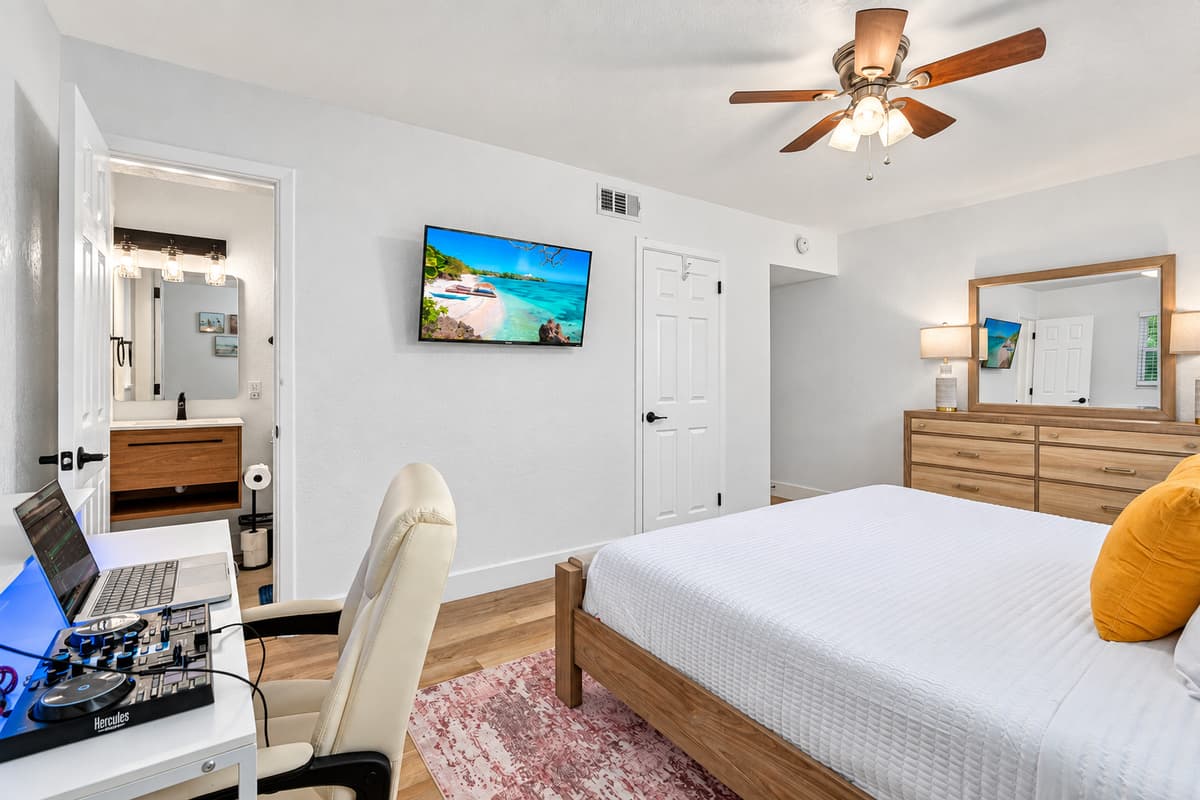 Designed for comfort and productivity, this stylish bedroom offers a plush bed, soft linens, and a dedicated workstation for remote work or planning beach adventures.