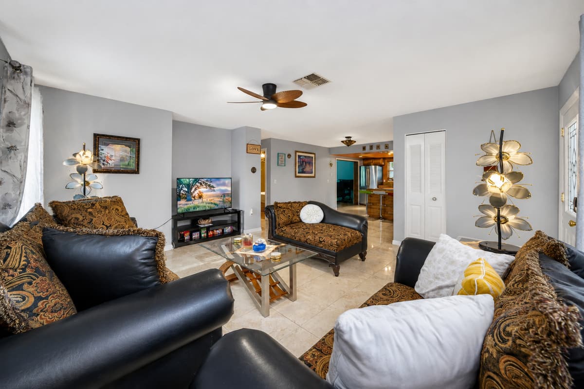 Inviting living area with cozy seating, large TV, and an open layout perfect for relaxing together.