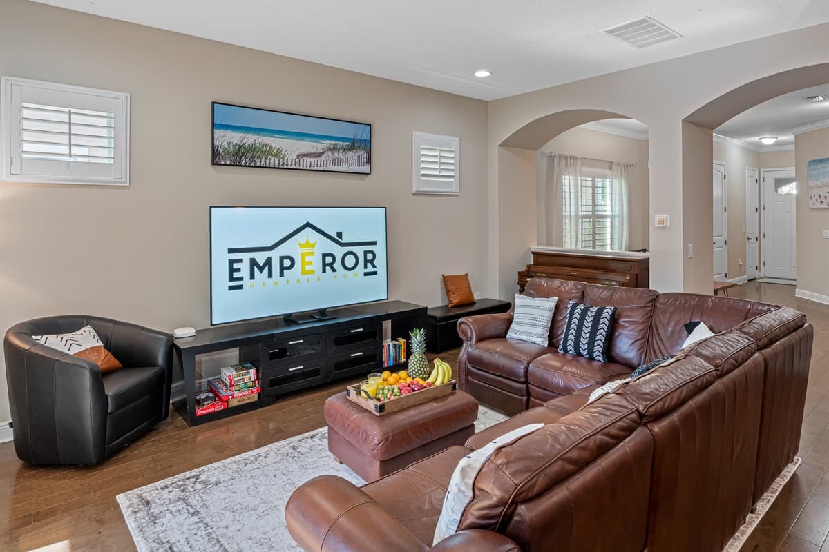 Who wouldn't love this elegant family room with comfortable couch, smart TV and a beautiful L-shaped couch? Have the best time with family and friends here! Book this property now!