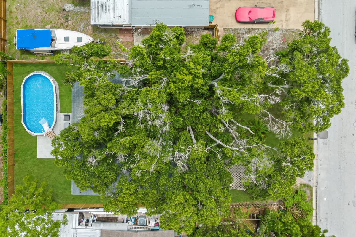Aerial top view of our incredible house showcasing the beautiful swimming pool!