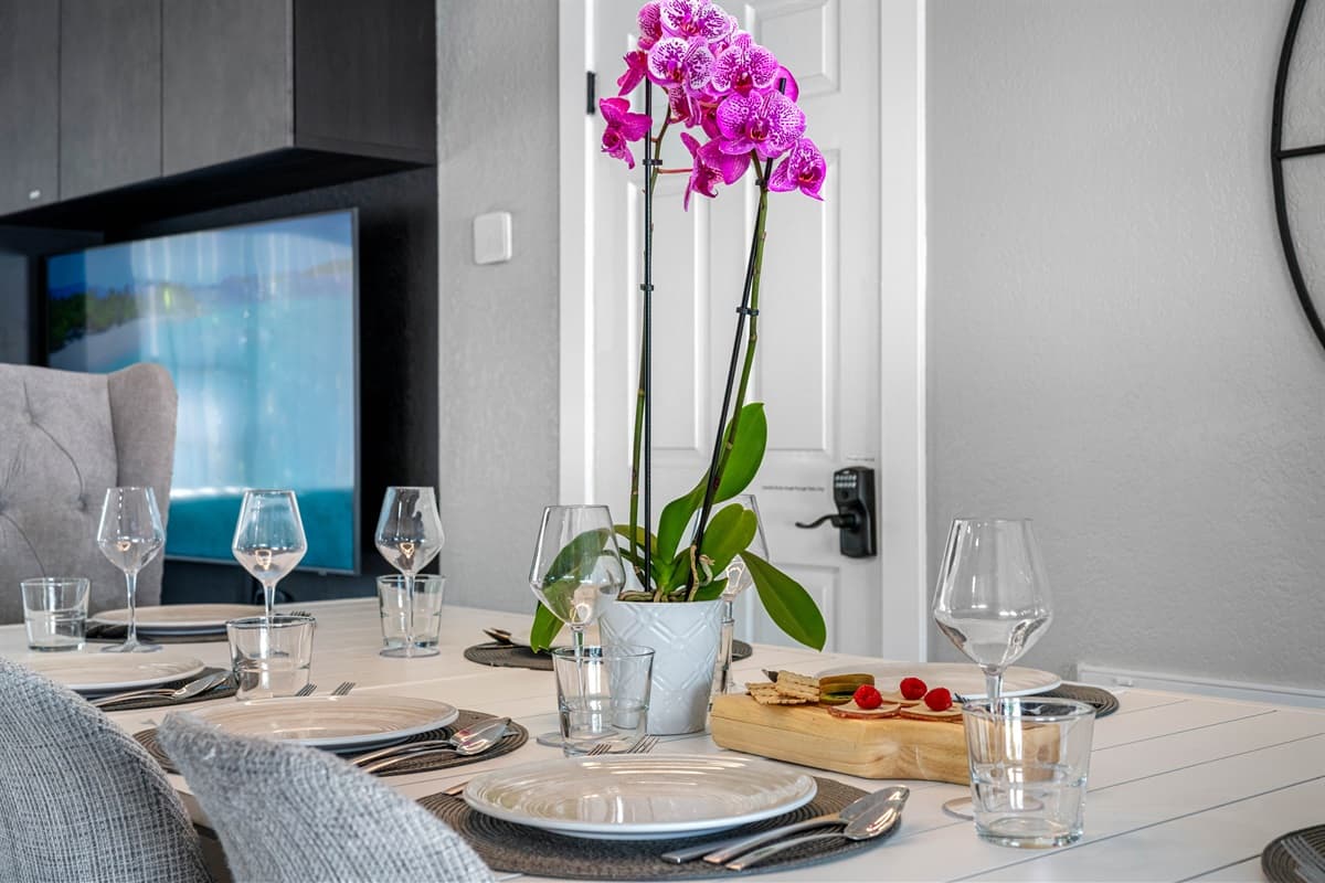 The dining space is thoughtfully positioned adjacent to our fully equipped kitchen, providing ultimate convenience for preparing and serving your favorite homemade dishes.