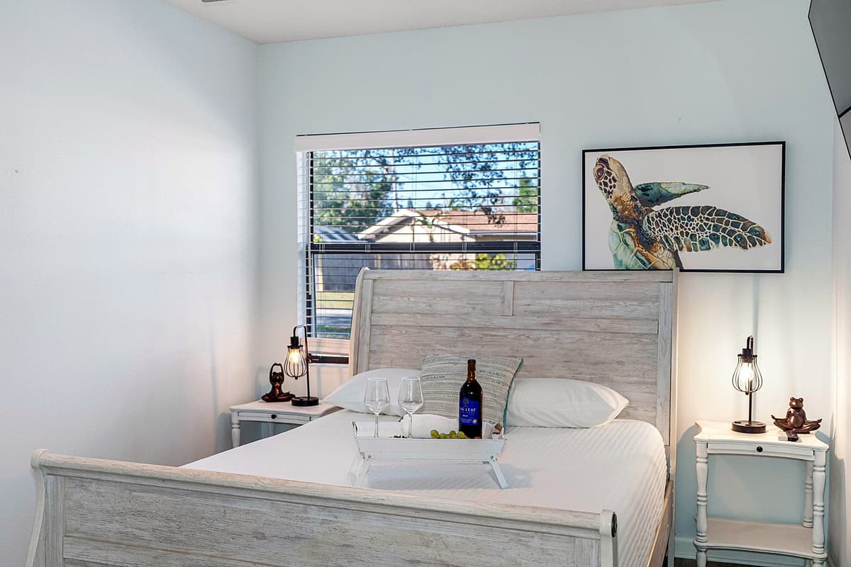 A large window allow natural light to brighten the room during the day, enhancing the airy feel of the space.
