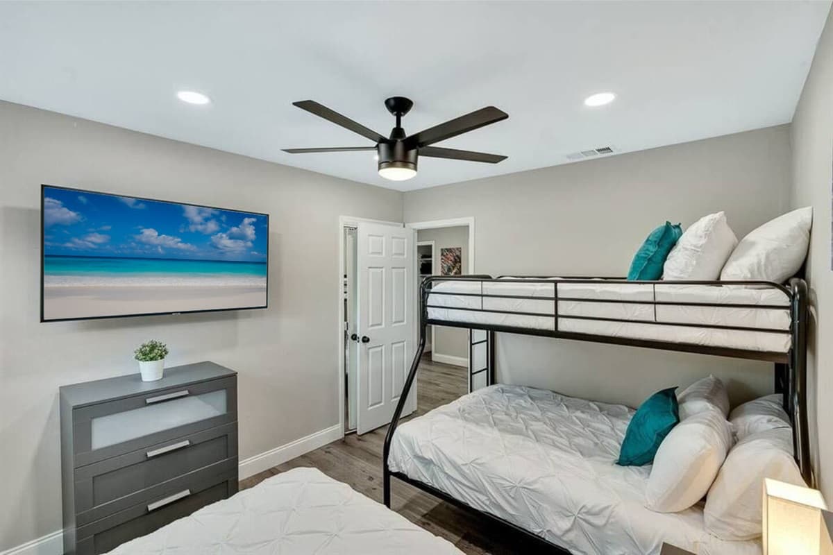 Amazing bedroom with single over twin bunkbed, queen sized bed, closets for storage and smart TV. Great room for families with kids or group of friends.