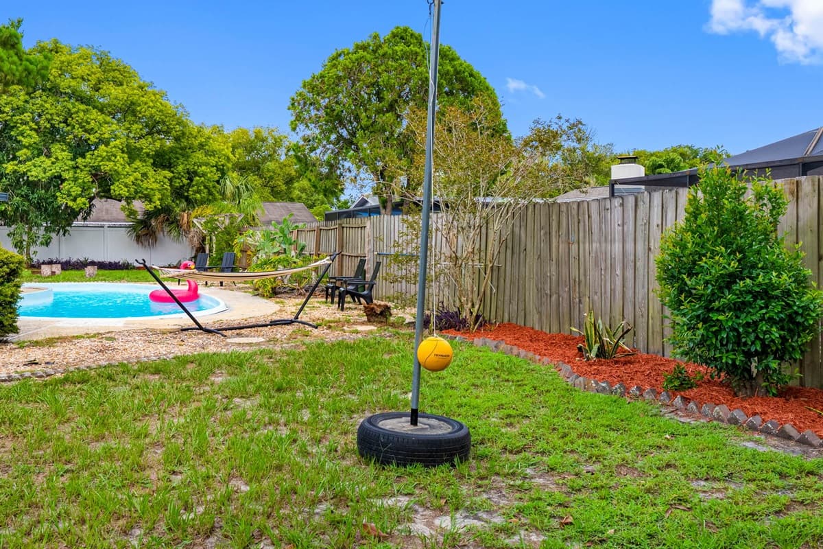 This backyard is your sunshine sanctuary—complete with a glistening private pool, plush lounge chairs, and cozy corners for conversation or cocktails.