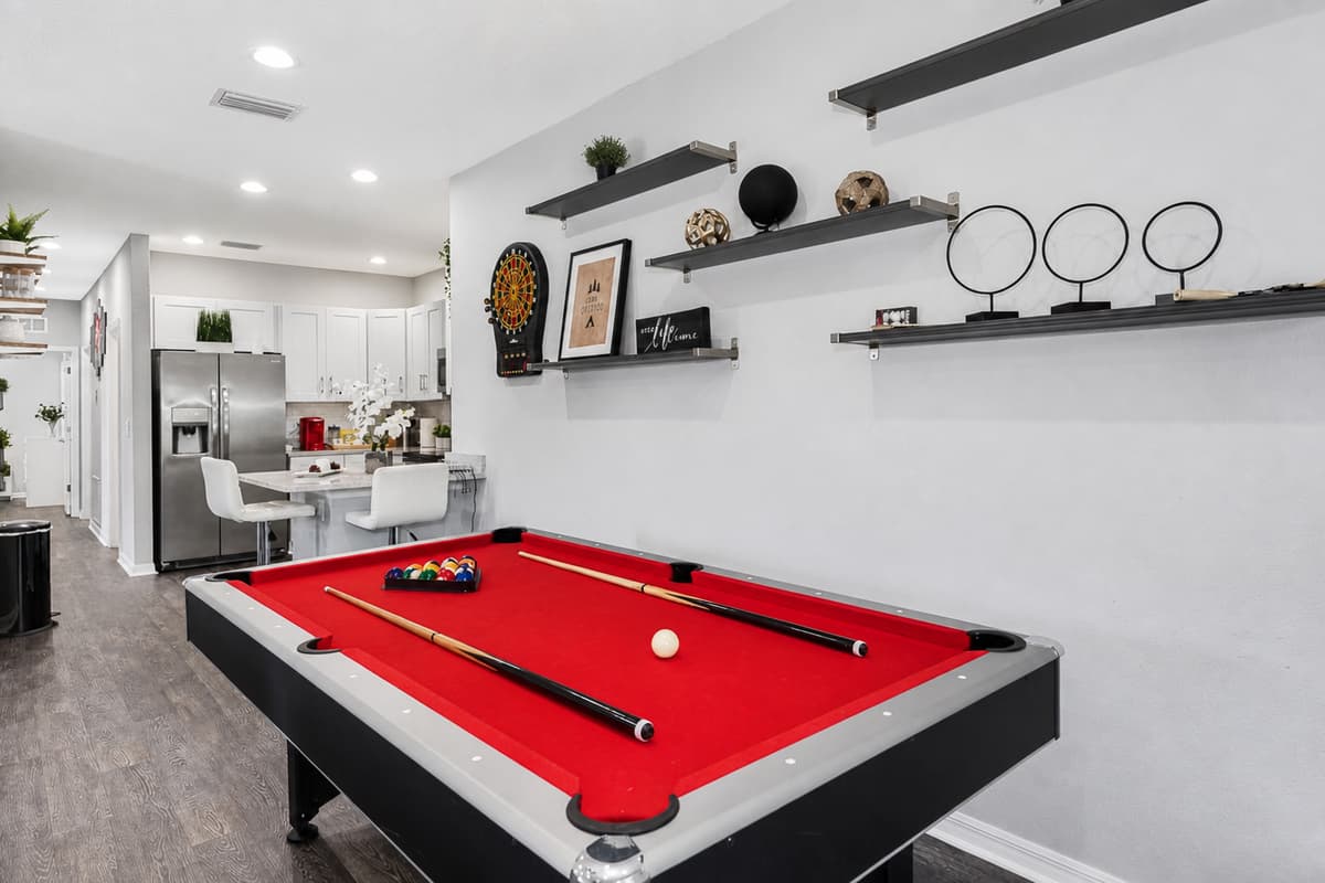 This well-appointed space is designed to offer seamless blend of entertainment options. At the heart of this area is a versatile pool table that effortlessly transforms into a ping pong table, catering to your every gaming preference.