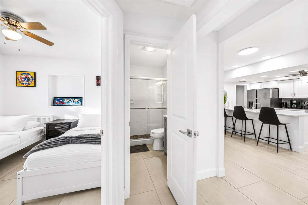 Bedroom entrance view showcasing easy access to the bathroom and open-concept living area.