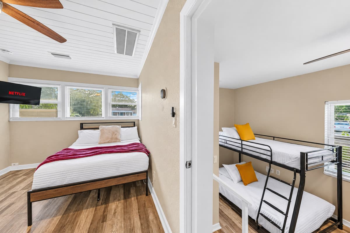 Bedrooms 3 and 4 are connected. To access Bedroom 4, you’ll need to pass through Bedroom 3. However, both bedrooms do have their own doors for privacy.