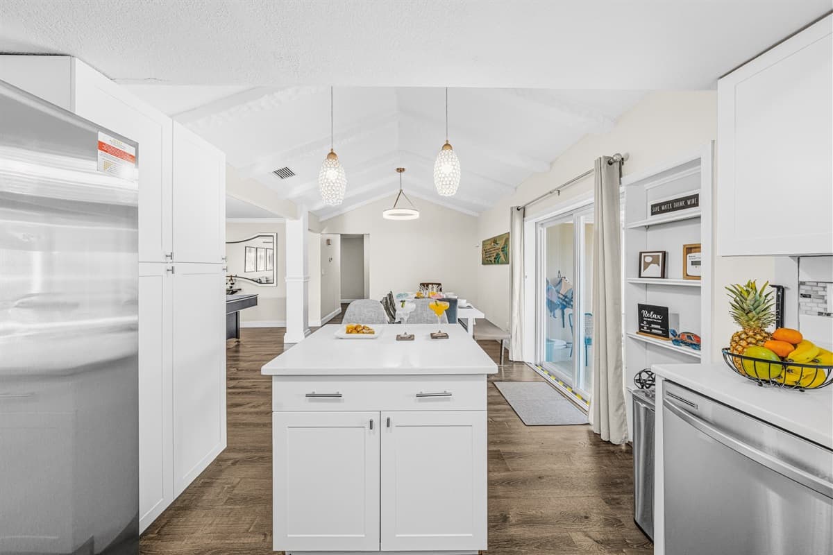 Fully equipped kitchen featuring stainless steel appliances and generous counter space.