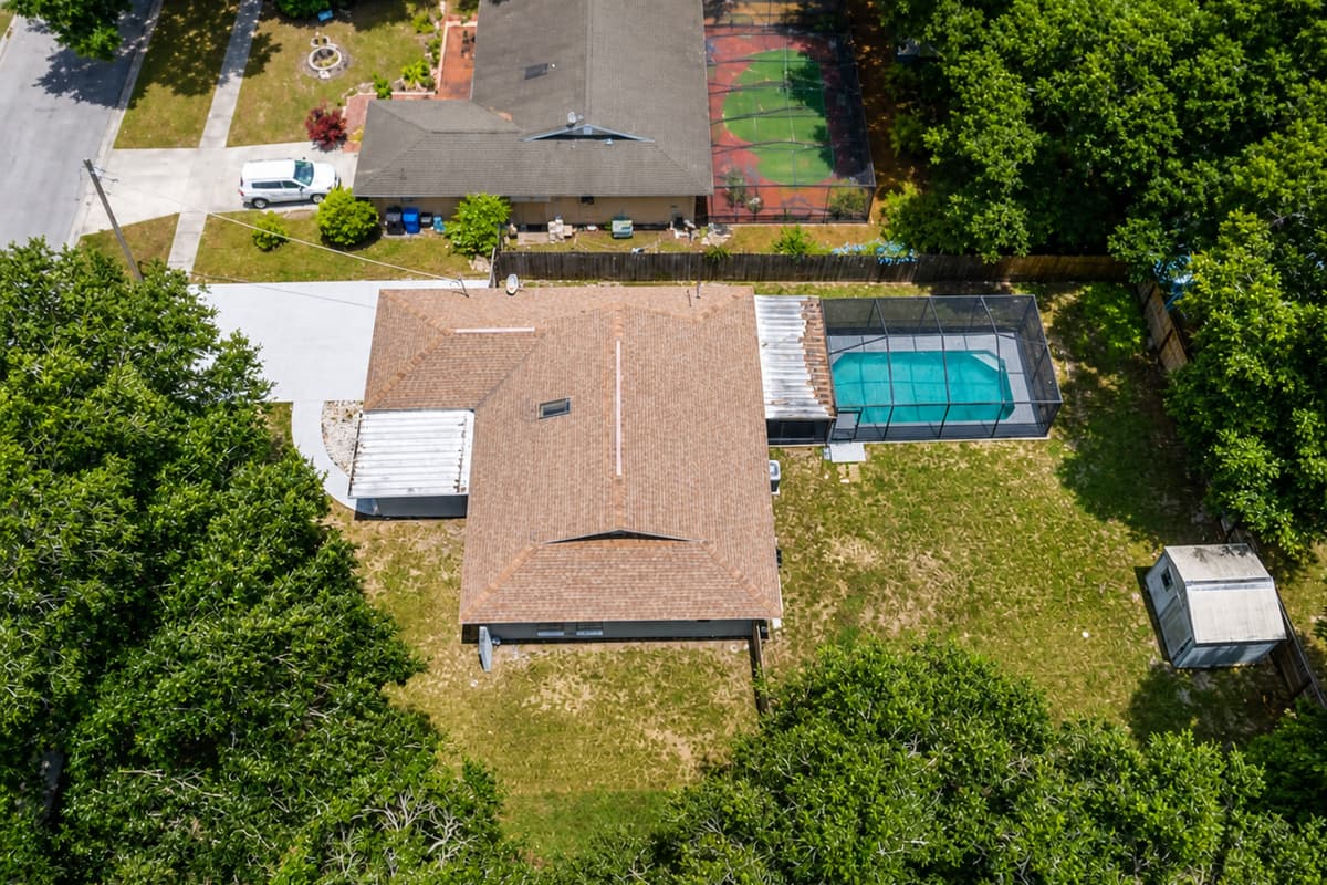 Aerial top view of our wonderful property what showcases our stunning heated pool, and beautiful driveway and our gorgeous fully fenced backyard. If you are interested in our property, send us an inquiry now!