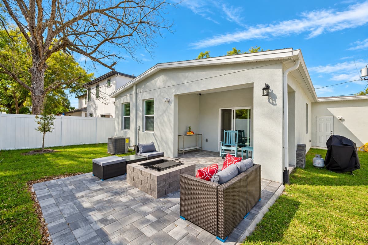 Step into our enchanting backyard patio and outdoor common area, where relaxation and enjoyment intertwine amidst the beauty of nature.
