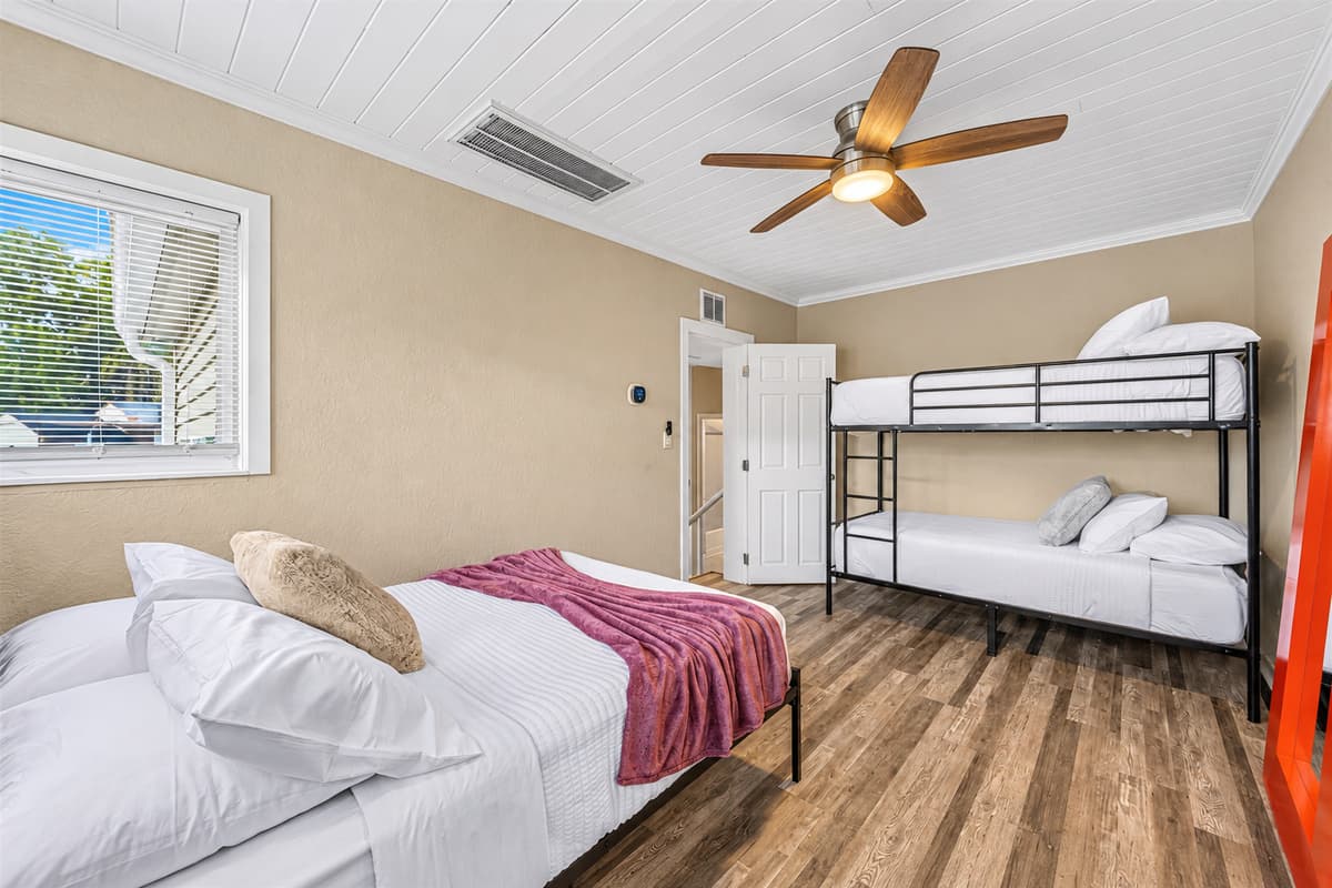 Spacious bunk room with multiple beds—ideal for families, kids, or group stays.