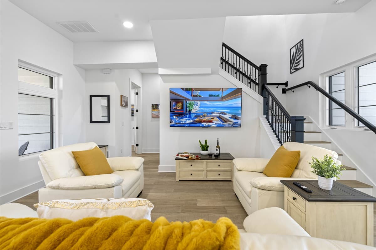 The open-plan living area seamlessly blends function and design, with thoughtful touches that make it feel like home.