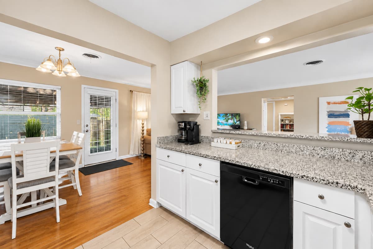 Open-concept kitchen with granite countertops and seamless access to the dining area.