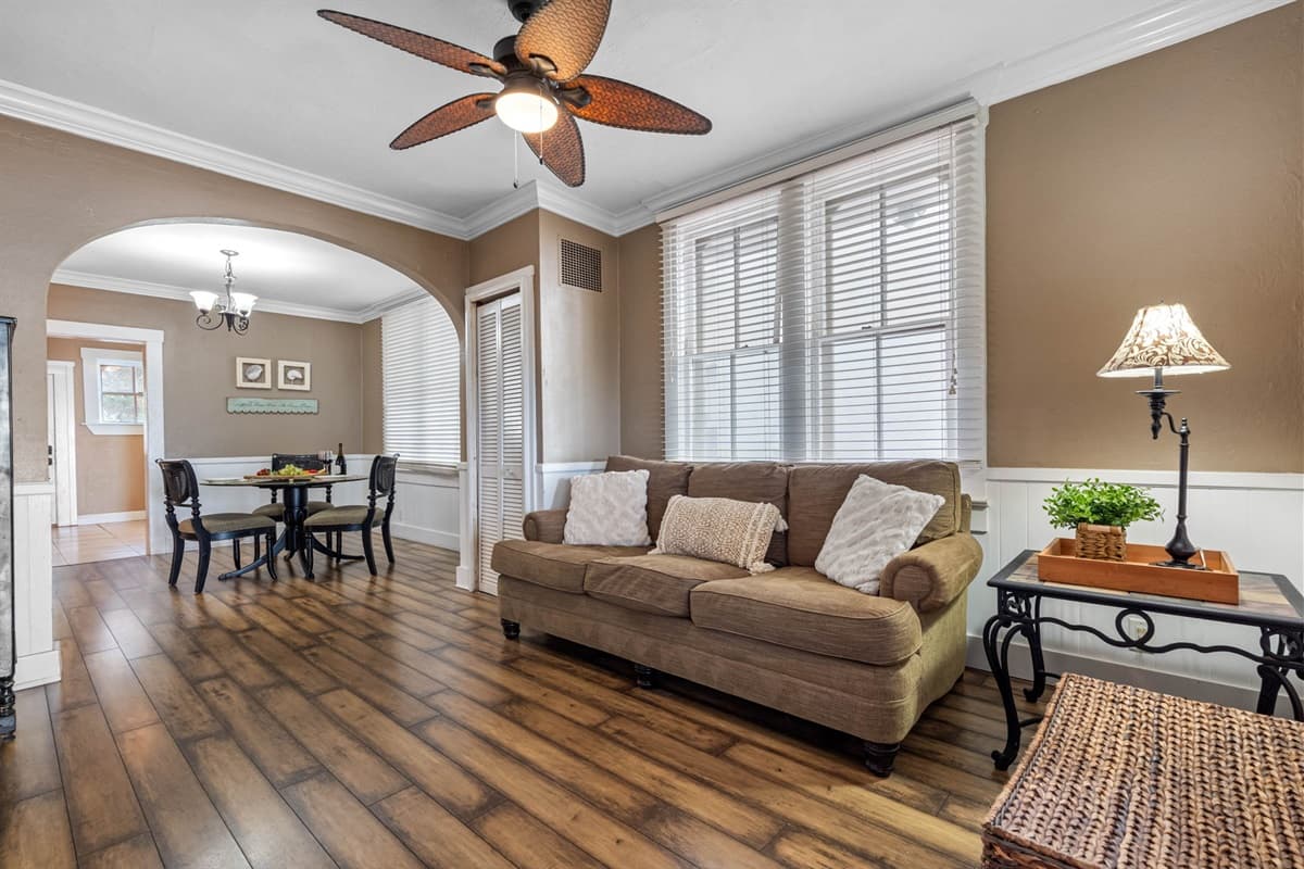 Soft lighting fixtures are carefully chosen to cast a warm glow throughout the room, creating a serene environment that’s perfect for both daytime lounging and evening relaxation.