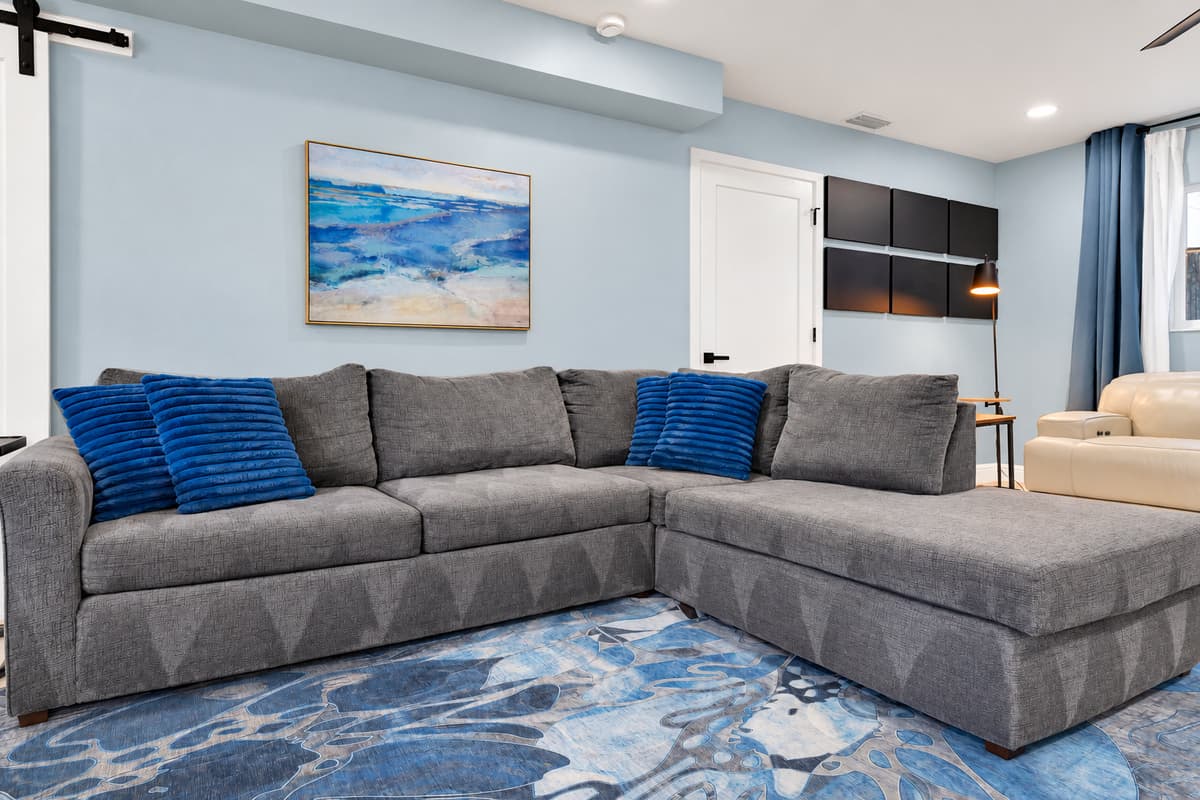 The couch that fills up first every evening. Wide, soft and long enough to lie down on properly, in a quiet room away from the kitchen and the water.