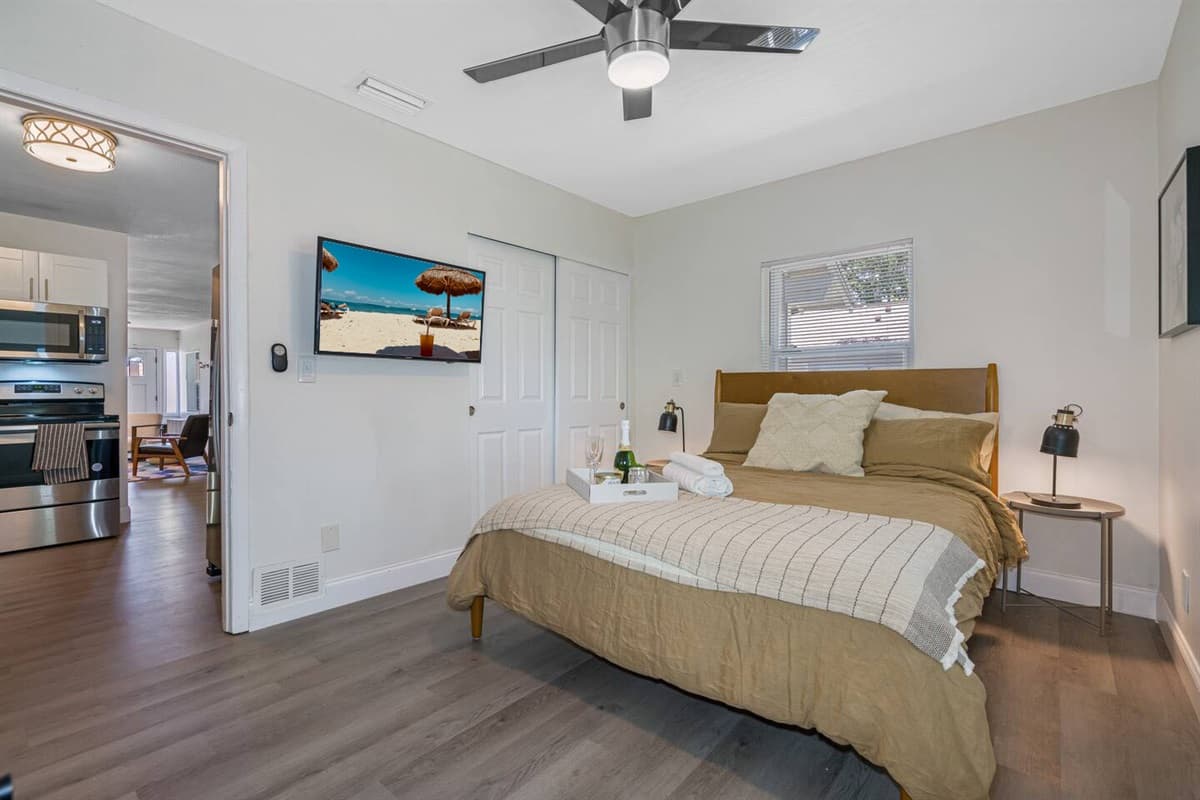 Exquisite bedroom with queen size bed, closet, vanity, and smart TV. Feel comfortable during your stay while making wonderful memories with family and friends. 