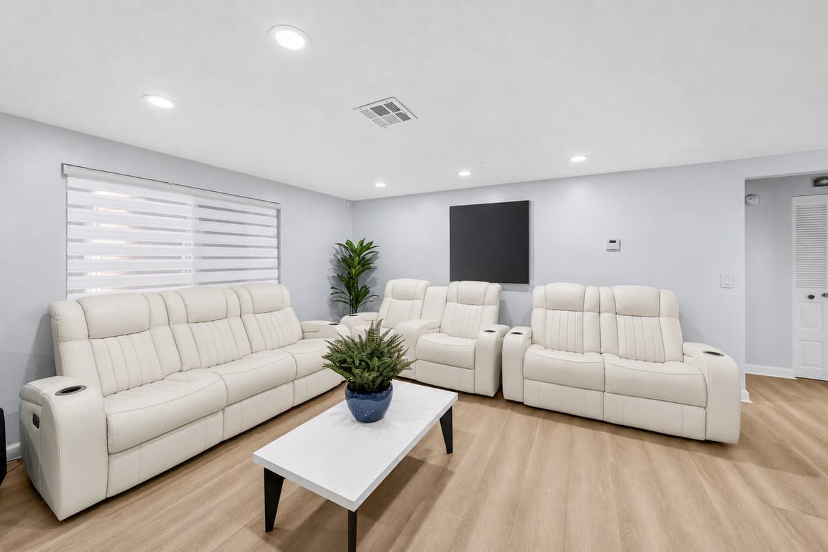 Comfortable lounge area with plush recliners and contemporary furnishings, perfect for unwinding after a day of exploring Tampa.