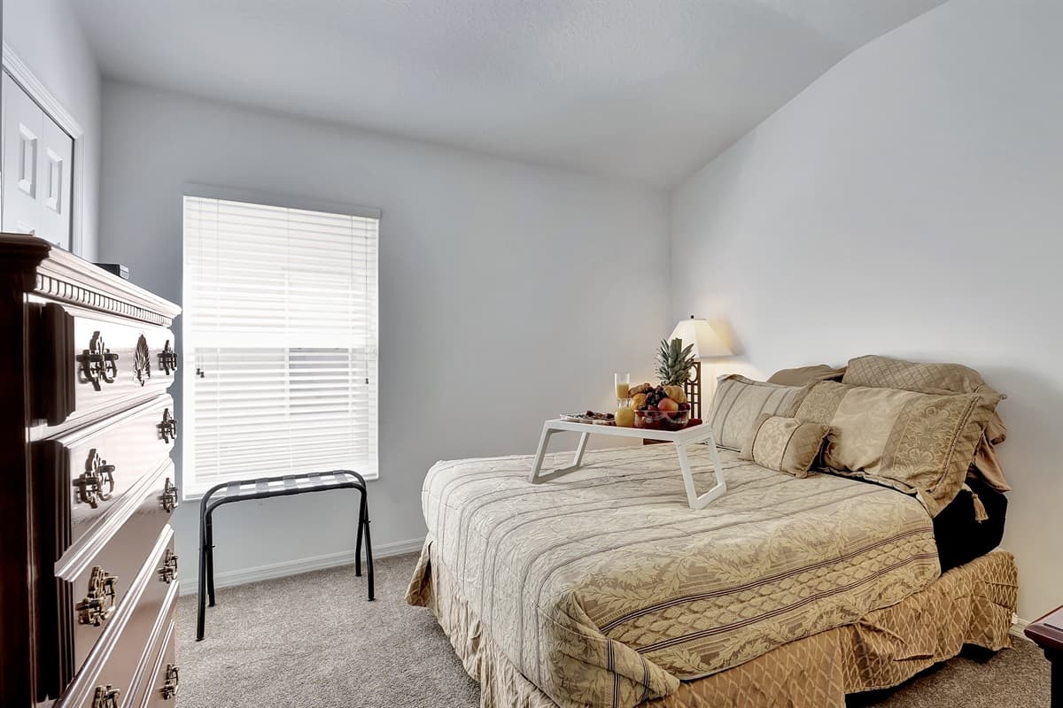 Sunlight dances through the curtains, casting a gentle glow that enhances the ambiance.
