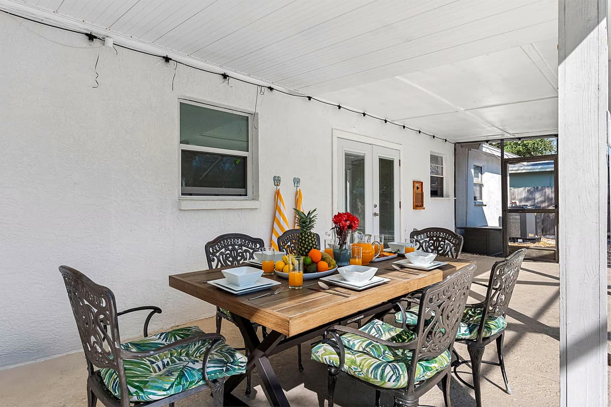 This inviting space offers a spacious dining table with comfortable seating, making it ideal for savoring delicious meals while basking in the fresh air and serene surroundings.