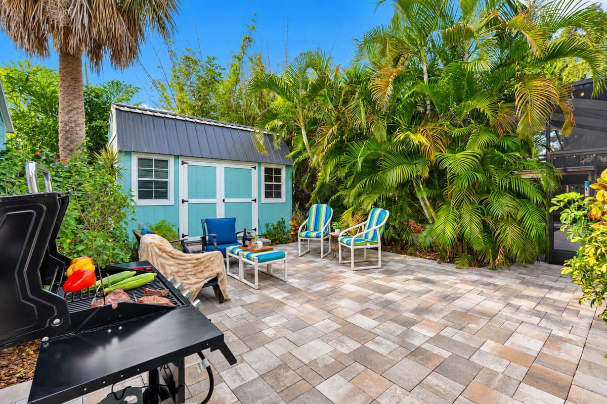A charming patio space featuring comfortable seating, ideal for unwinding with a drink or good conversation.
