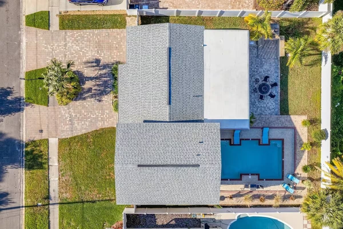 Top view of our immaculate property showcasing the stunning heated salt pool and lounge area at the back of the property. 