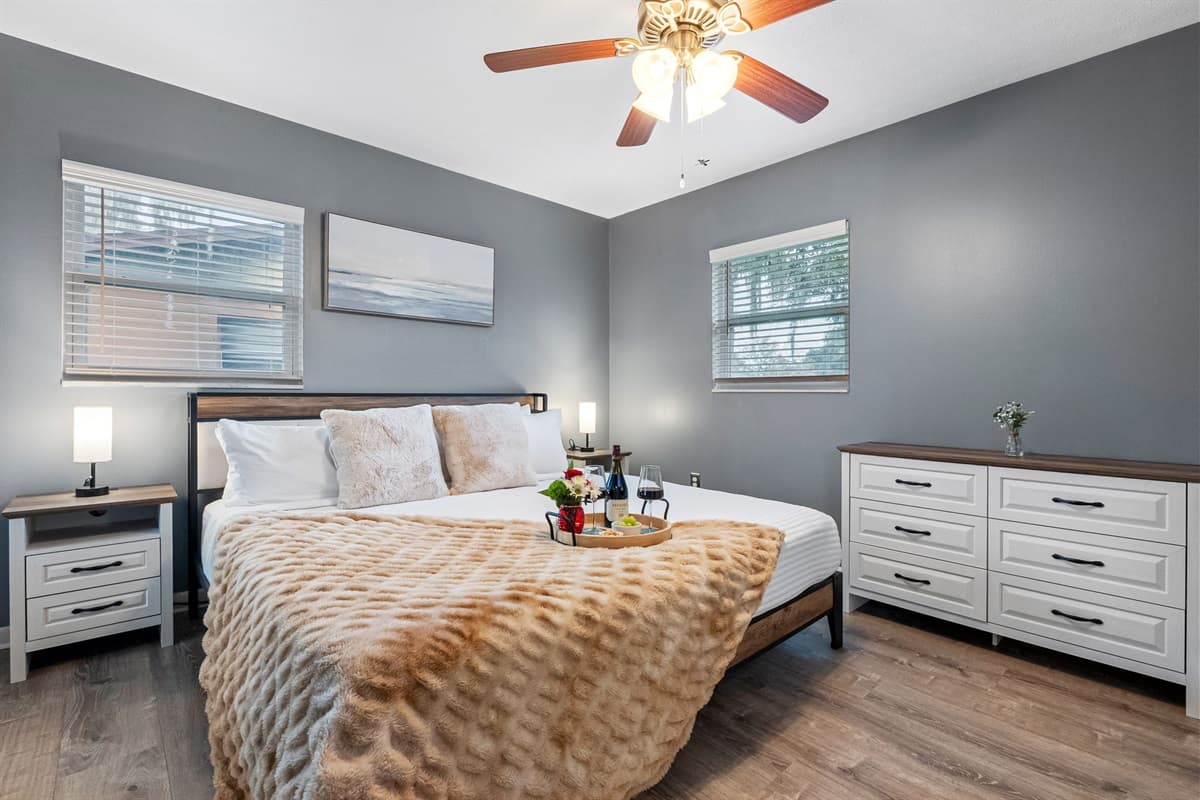 Elegant king suite featuring plush bedding and calming tones.