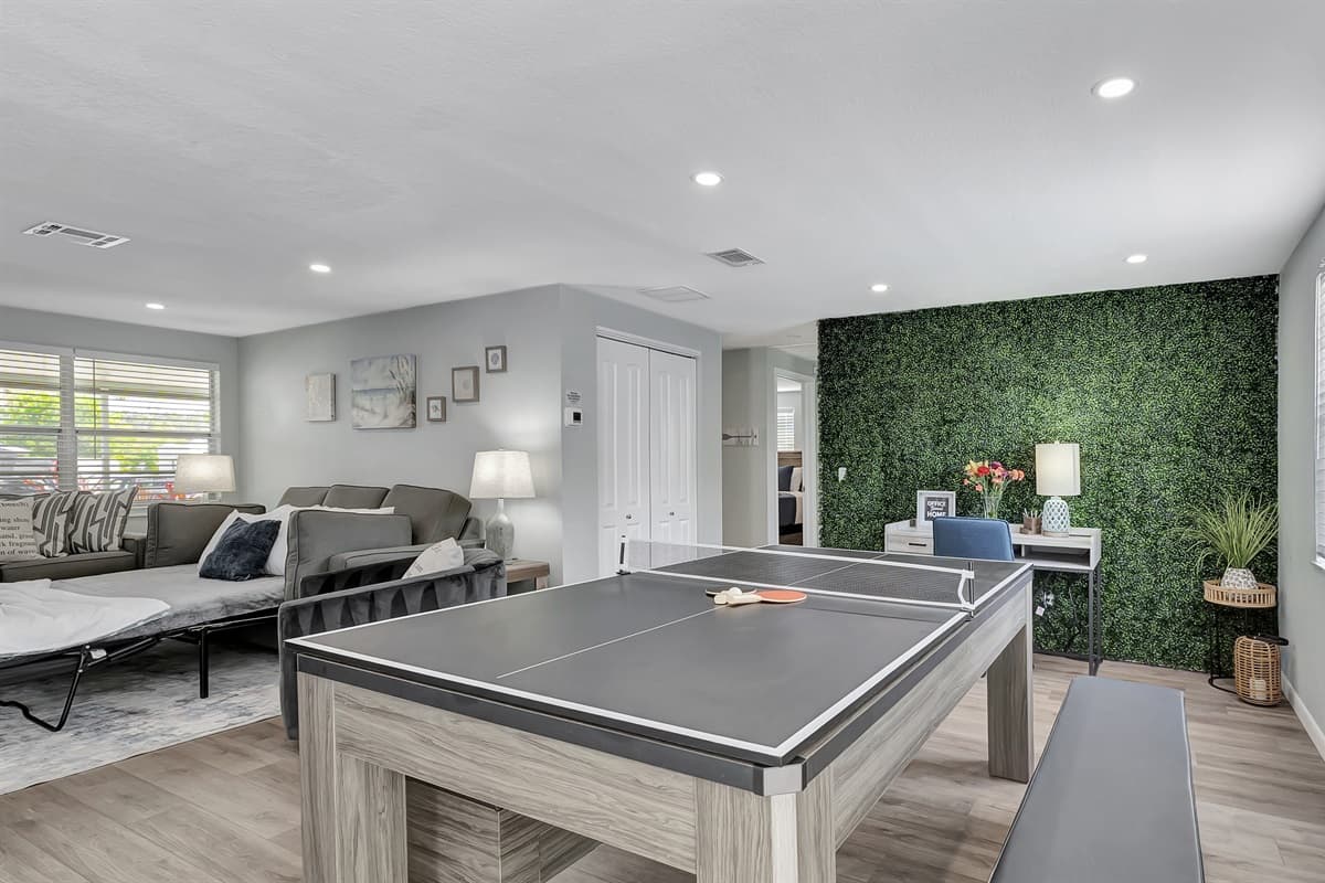 This table seamlessly transitions into a source of excitement, serving dual purposes as both a pool table and a ping pong table.