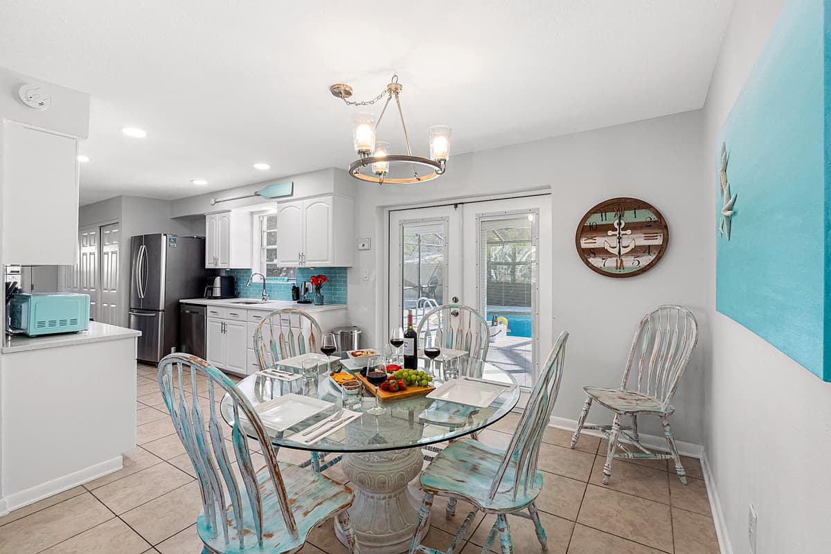 Large windows nearby allow natural light to fill the room, enhancing the warm and welcoming ambiance.