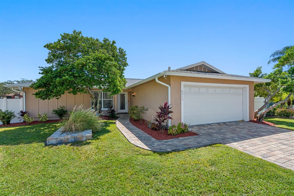 Stunning front view of the house showcasing the front yard and parking area that is equipped with CCTV cameras to ensure your safety during your stay. If you are interested in this property, send us an inquiry now!