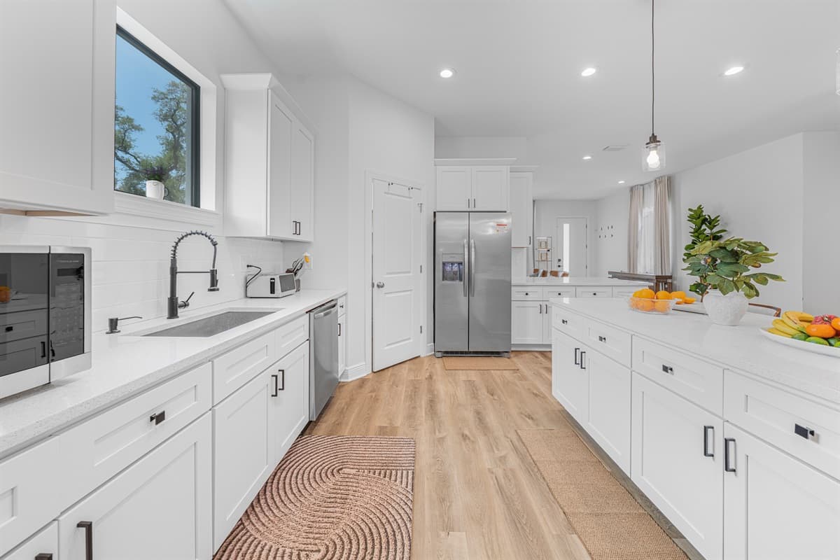 Bright kitchen island with fresh accents and open layout—perfect for meal prep and casual dining.