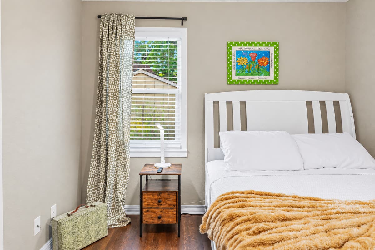 Cozy bedroom with comfortable bed, soft linens, and natural light—perfect for a restful stay.