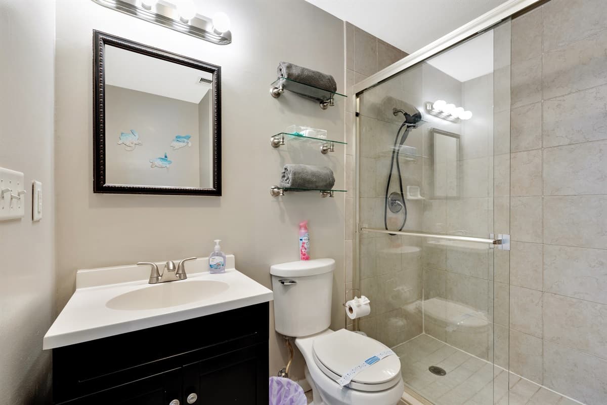 Step into luxury with this spacious ensuite bathroom, designed to provide a serene and refreshing experience.