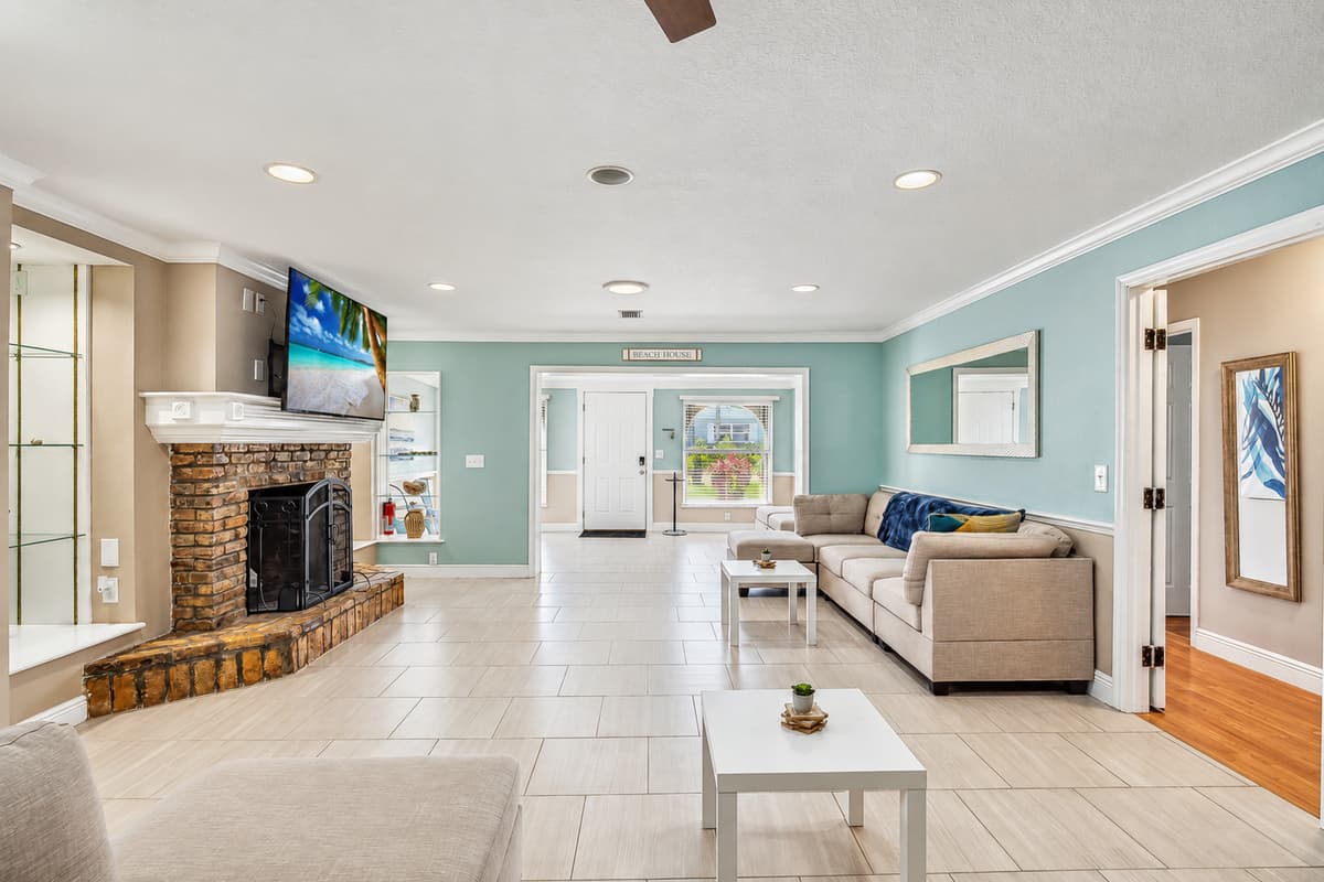 Living room with plenty of seating for the family and large UHD Smart TV