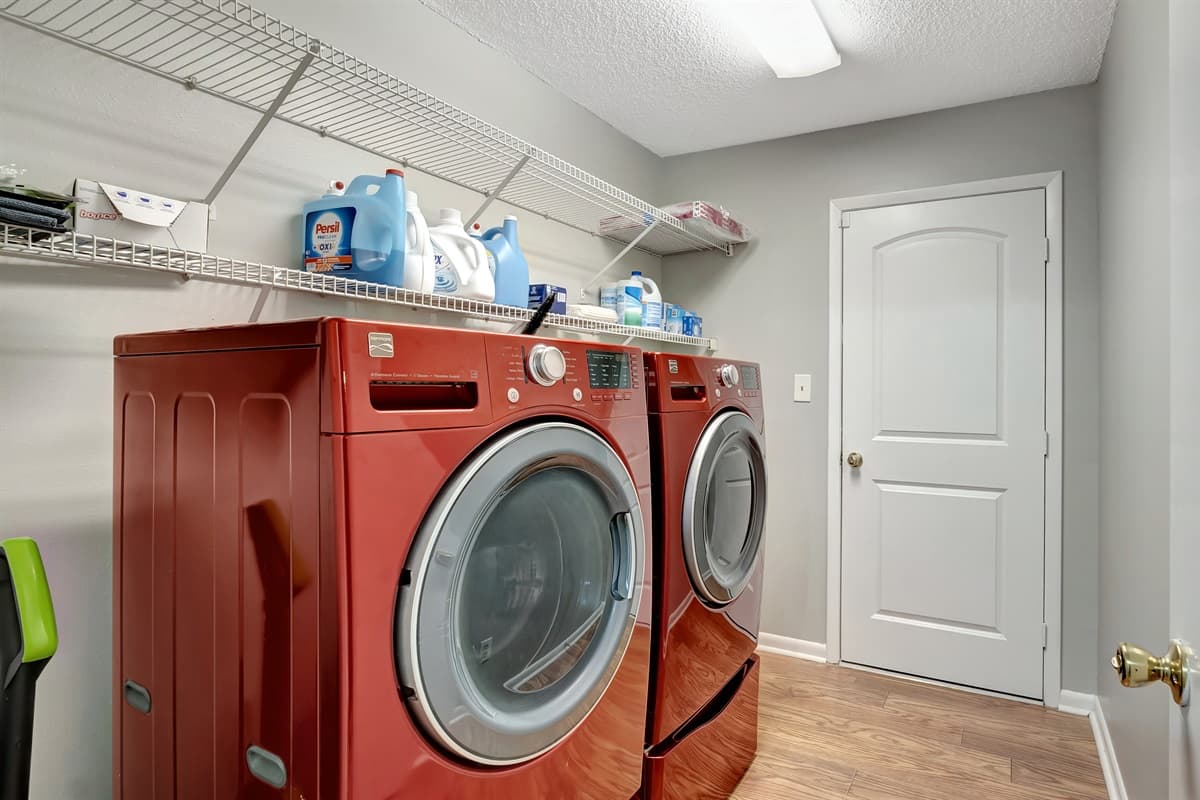 This is our laundry space, complete with a washer and dryer, as well as all the essential tools for your laundry needs.