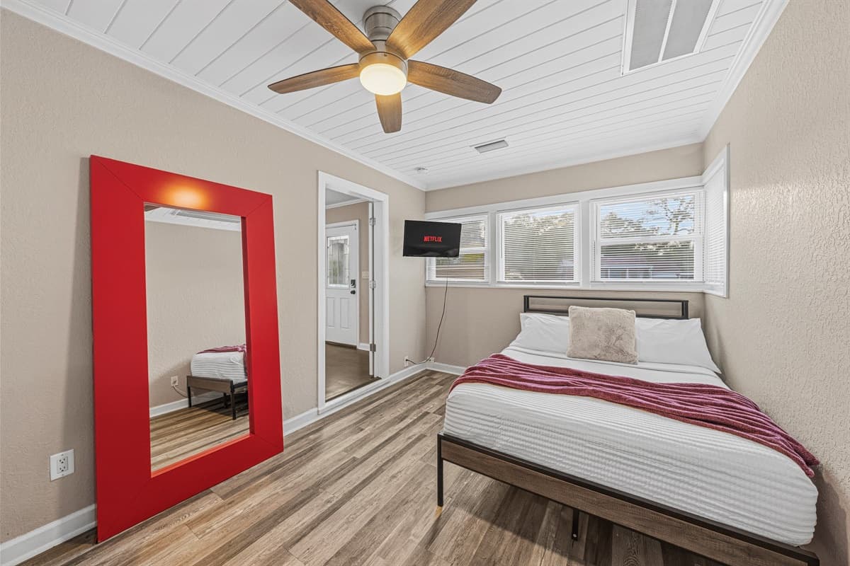 Comfortable bedroom with modern design, cozy bedding, and stylish accents.
