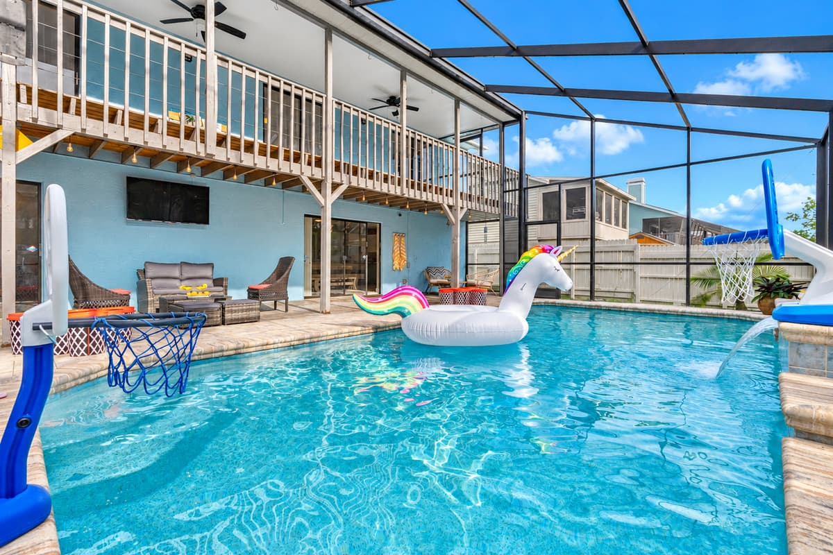 Take a dip in the crystal-clear waters of this inviting pool, framed by elegant paver decking and highlighted by a soothing cascading waterfall.