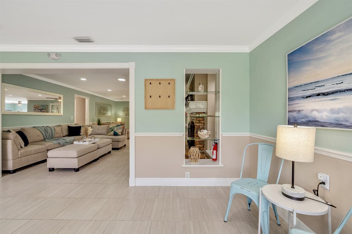 This thoughtfully designed space serves as a welcoming alcove, providing a charming spot for guests to gather and unwind.